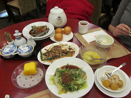 From left to right: Steamed eggplant in garlic and soy sauce, cripsy custard buns, flat noodles in XO sauce, mango sago pomelo, small glutinous rice balls with crushed peanuts, vegetable dumplings in a chili sauce, mango pancakes